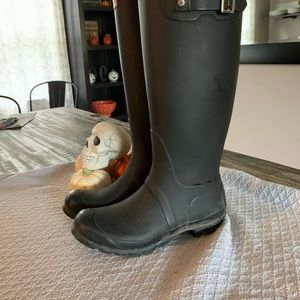 Tall black hunter boots